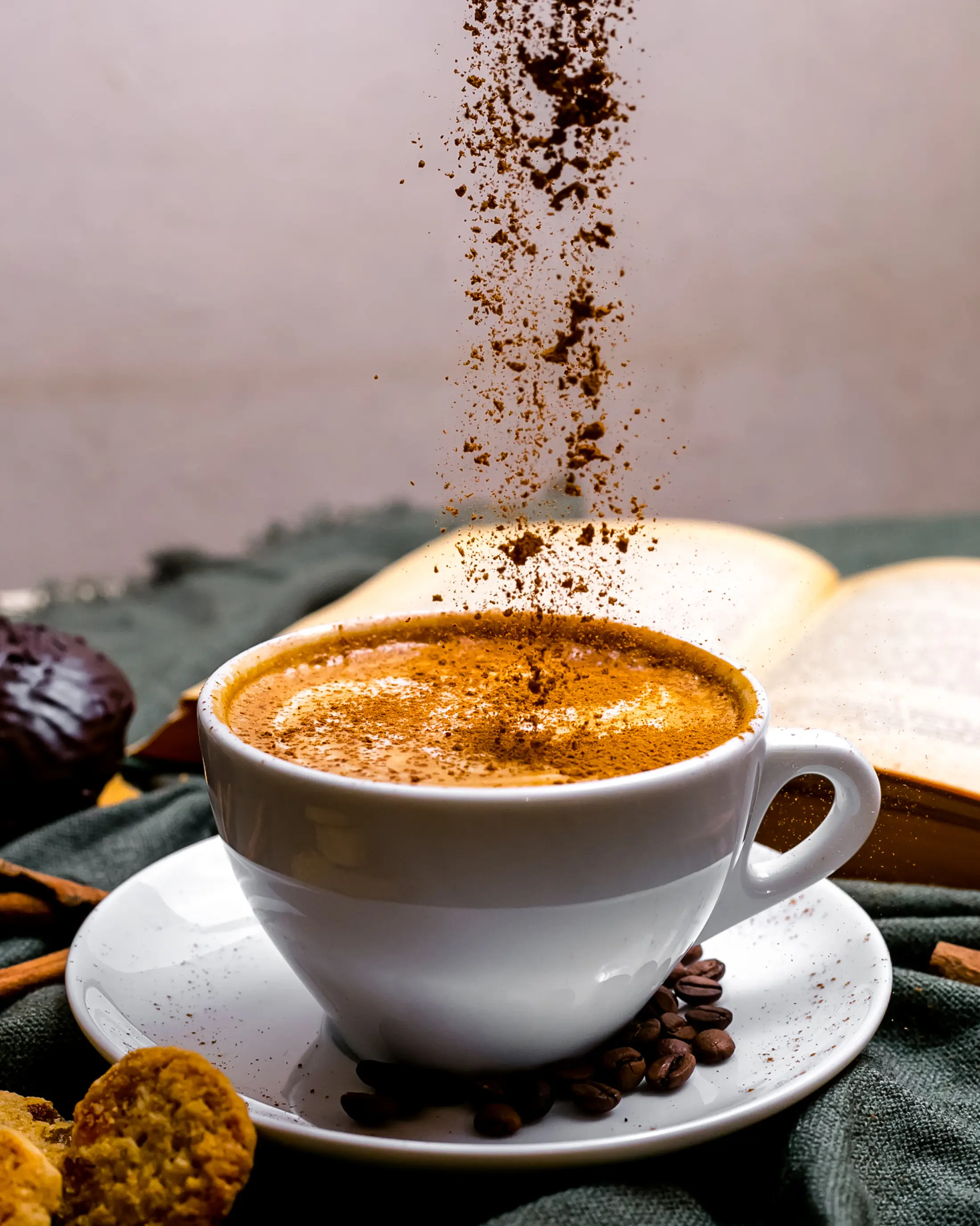 front-view-cup-cappuccino-with-cookies-book-table